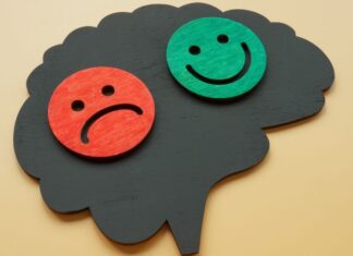 Com tantos tratamentos novos, por que o lítio ainda é referência no transtorno bipolar? cérebro com rosto feliz e rosto triste, representando o transtorno bipolar