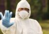Surto de Ebola 2026: atualização epidemiológica e risco para o Brasil Profissionais de saúde utilizando equipamentos de proteção individual durante resposta a surto de Ebola.